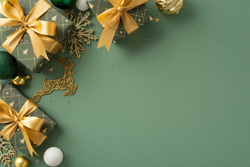 Trendy Christmas concept. Top view of gifts tied with ribbons, lavish ornaments, reindeer and...