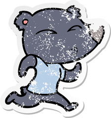 distressed sticker of a cartoon jogging bear