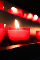 red romantic candle with warm light and a spiritual feeling