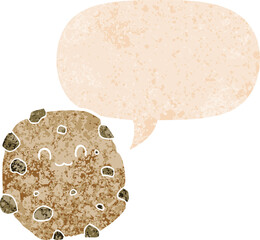 cartoon biscuit with speech bubble in grunge distressed retro textured style