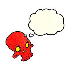 cartoon spooky skull with thought bubble