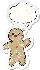 cartoon gingerbread man with thought bubble as a distressed worn sticker