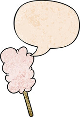 cartoon candy floss on stick with speech bubble in retro texture style
