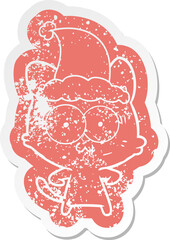 quirky cartoon distressed sticker of a surprised cat wearing santa hat