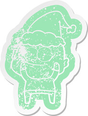 quirky cartoon distressed sticker of a bald man staring wearing santa hat