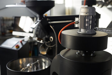 Close up background image of coffee bean roaster machine and equipment in shop, copy space