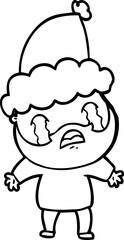 hand drawn line drawing of a bearded man crying wearing santa hat