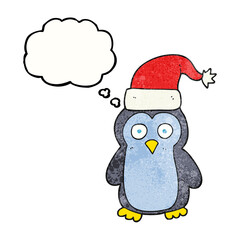 freehand drawn thought bubble textured cartoon christmas penguin