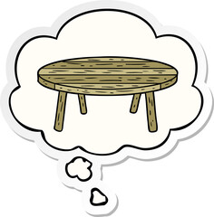 cartoon table with thought bubble as a printed sticker