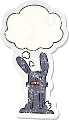 cartoon rabbit with thought bubble as a distressed worn sticker