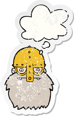 cartoon viking face with thought bubble as a distressed worn sticker