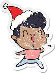 hand drawn distressed sticker cartoon of a excited man wearing santa hat