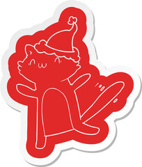 quirky cartoon  sticker of a dancing cat wearing santa hat
