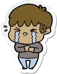 sticker of a cartoon boy crying