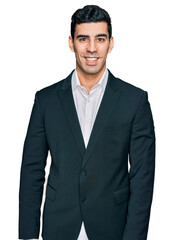 Handsome hispanic man wearing business clothes with a happy and cool smile on face. lucky person.