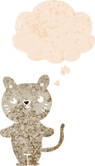cartoon cat with thought bubble in grunge distressed retro textured style