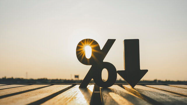 Percentage model and down arrow with evening sky Key concepts for success, methods, systems of raising or lowering Fed interest rates to correct inflation concepts.