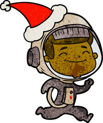 happy hand drawn textured cartoon of a astronaut wearing santa hat