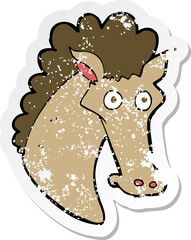 retro distressed sticker of a cartoon horse head