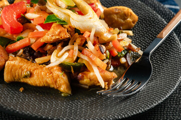 Pieces of fried chicken with vegetables.