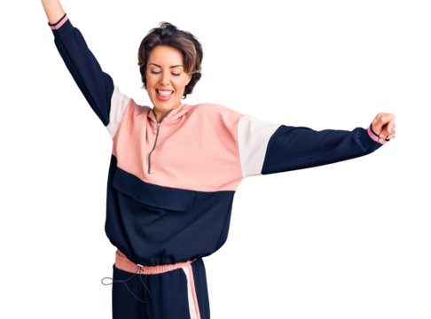 Young beautiful woman wearing sportswear dancing happy and cheerful, smiling moving casual and confident listening to music