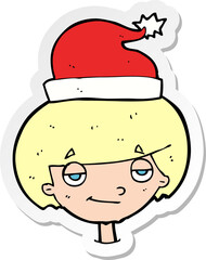 sticker of a cartoon boy in santa hat