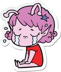 sticker of a cartoon crying alien girl
