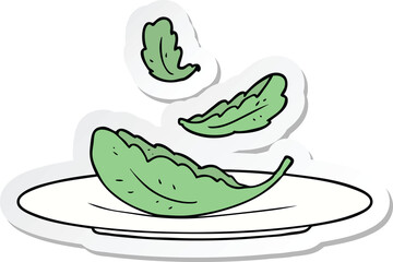 sticker of a cartoon salad leaves