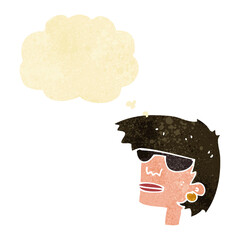 cartoon female face with glasses with thought bubble