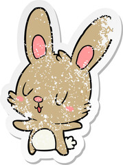 distressed sticker of a cute cartoon rabbit