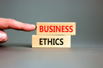 Business ethics symbol. Concept words Business ethics on beautiful wooden blocks. Beautiful grey...