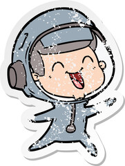Obraz premium distressed sticker of a happy cartoon astronaut