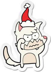 hand drawn sticker cartoon of a annoyed fox wearing santa hat