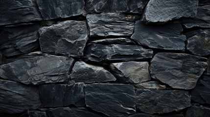 Background of mountain stones of different sizes in black and gray. Texture of stones for design.
