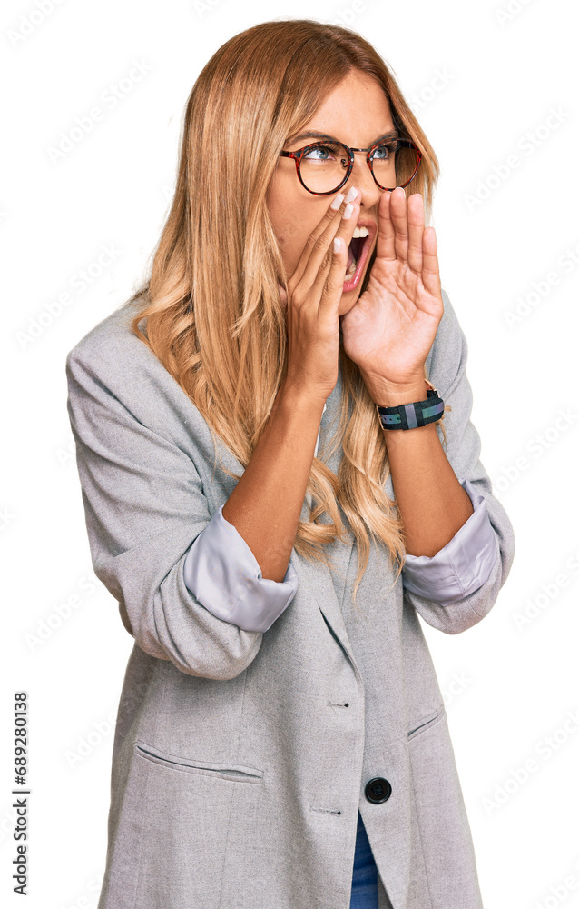 Sticker Beautiful blonde young woman wearing business clothes shouting angry out loud with hands over mouth