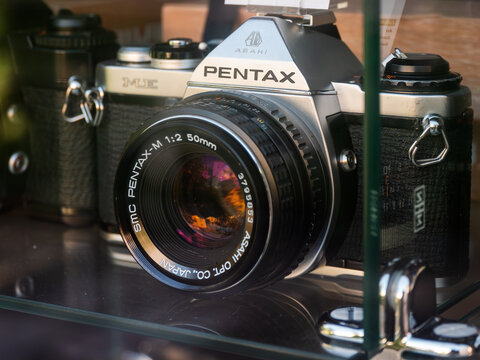 Used Vintage Pentax Camera with Lens in the Shop Window Display Case