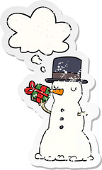 cartoon snowman with thought bubble as a distressed worn sticker