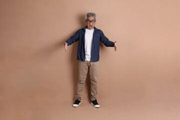 Fototapeta premium Asian energetic senior man