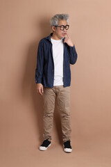 Fototapeta premium Asian energetic senior man