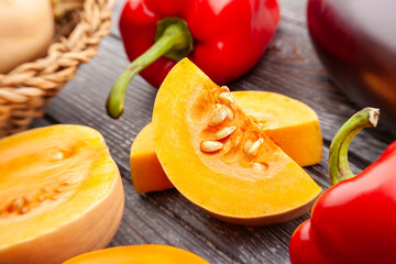 sliced butternut on wood background