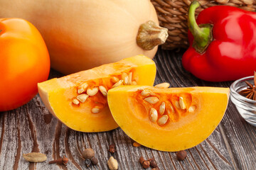 sliced butternut on wood background