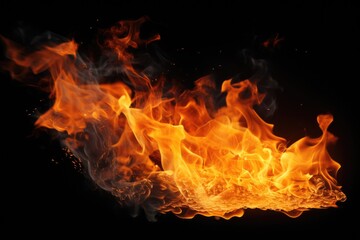 A close-up view of a vibrant fire burning on a black background. This captivating image captures the intense heat and mesmerizing flames.
