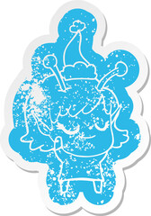 smiling alien girl quirky cartoon distressed sticker of a wearing santa hat
