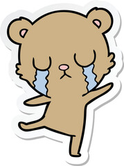 sticker of a crying cartoon bear doing a sad dance