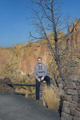 Naklejka na ściany i meble Attractive Young Man Enjoys Smith Rock State Park