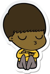 sticker of a cartoon calm boy