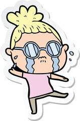 Obraz premium sticker of a cartoon crying woman wearing spectacles
