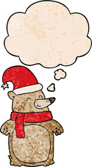 cartoon christmas bear with thought bubble in grunge texture style