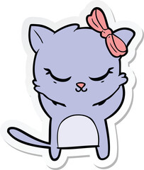 sticker of a cute cartoon cat with bow