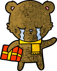 crying cartoon bear with present